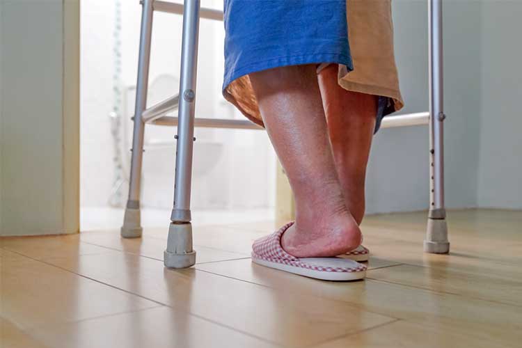 Elderly patient using walking frame | Image