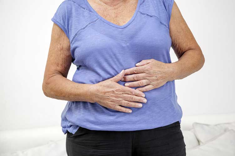 older woman experiencing constipation