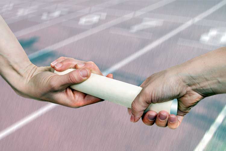 Relay baton being passed