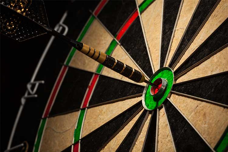 Dart in bullseye on dart board