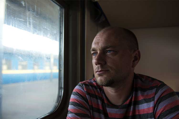 man sitting on train