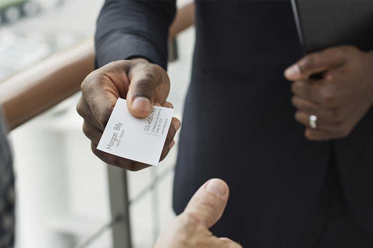 Person passing business card | Image