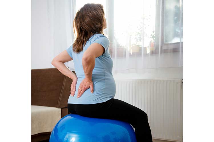 Pregnant woman on bosu ball | Image