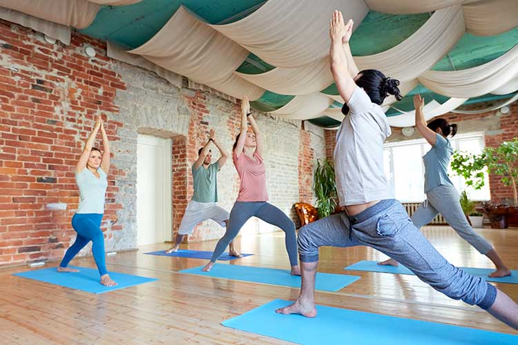 People doing yoga | Image