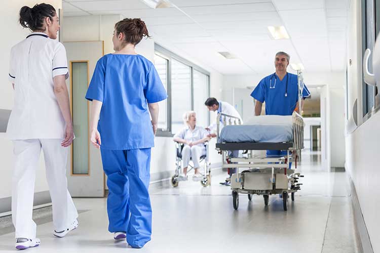 Hospital hallways populated with health professionals