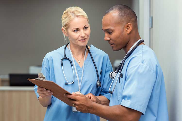 Nurses communicating with each other calmly