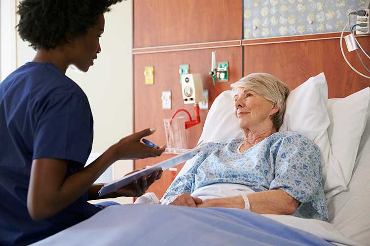 nurse talking to stroke patient