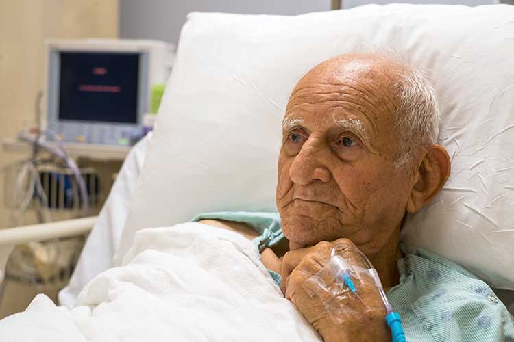 older man in hospital bed