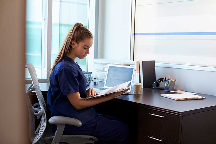 nurse studying at desk