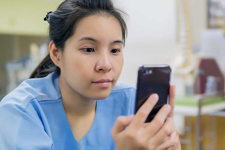 nurse reading on smartphone