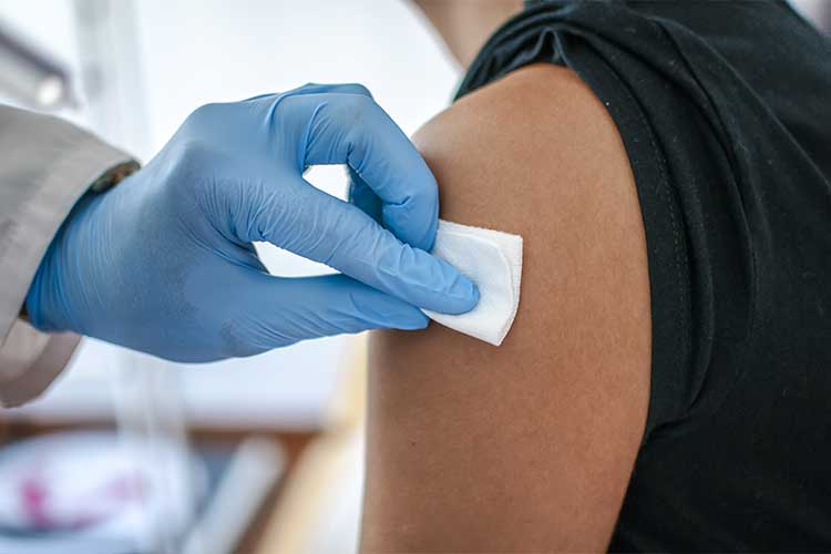 nurse receiving vaccination