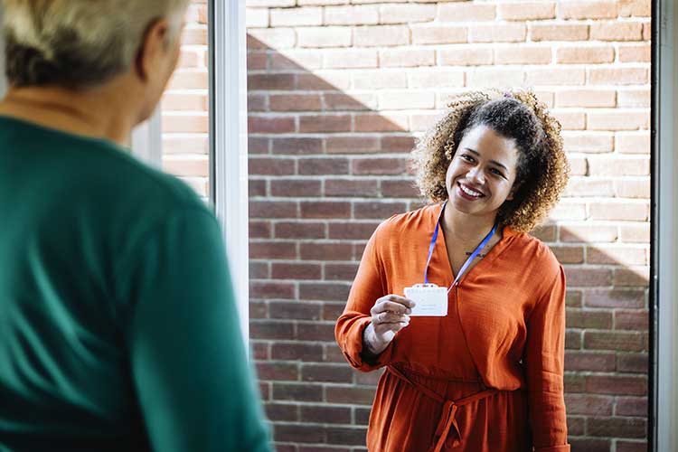 home carer worker arriving at client home