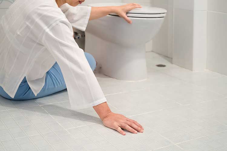 older adult falling in bathroom