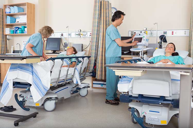 nurses checking on postoperative patients