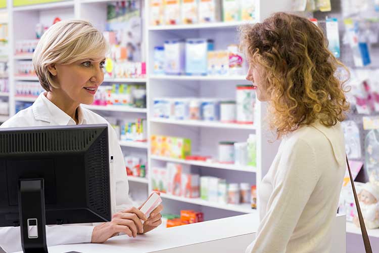 pharmacist helping client