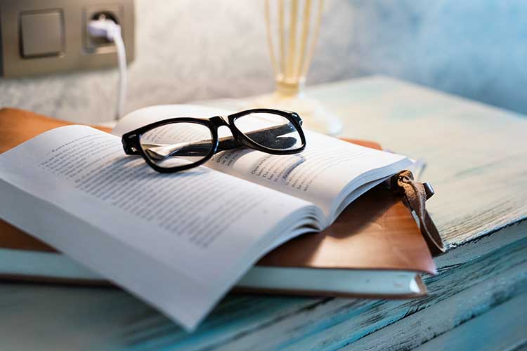 client glasses on bedside table