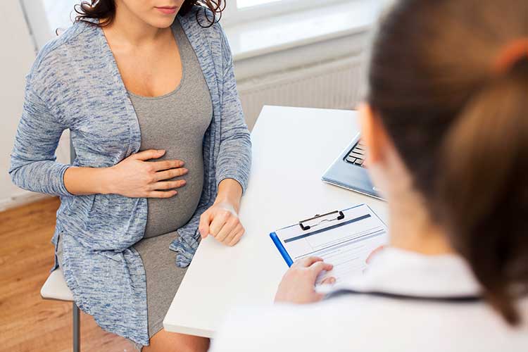 pregnant woman receiving education cytomegalovirus